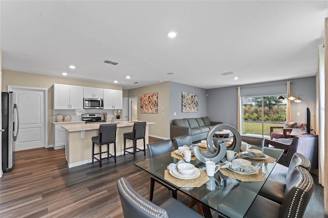 3430 Briarwood Grove Dr, Ocoee, FL 34761 - dining area with dark wood finished floors and recessed lighting