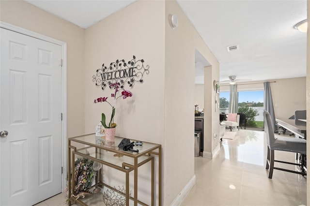 214 Majors Ln Unit B, Kissimmee, FL 34743 - hallway featuring baseboards and light tile patterned floors