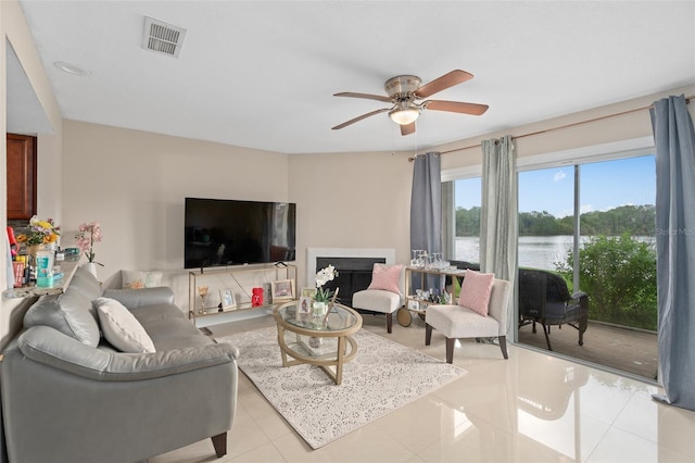 214 Majors Ln Unit B, Kissimmee, FL 34743 - living room with light tile patterned flooring and a ceiling fan