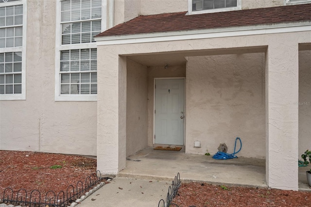 214 Majors Ln Unit B, Kissimmee, FL 34743 - entrance to property featuring stucco siding and roof with shingles