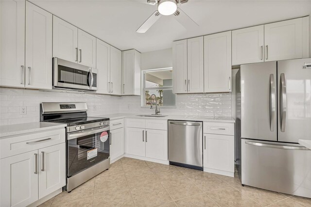 1764 Boca Raton Ct, Punta Gorda, FL 33950 - kitchen featuring stainless steel appliances, a sink, ceiling fan, and light countertops