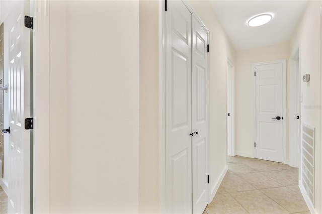 1764 Boca Raton Ct, Punta Gorda, FL 33950 - corridor featuring light tile patterned floors and baseboards