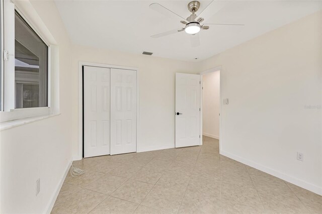 1764 Boca Raton Ct, Punta Gorda, FL 33950 - unfurnished bedroom with baseboards, a closet, and light tile patterned flooring