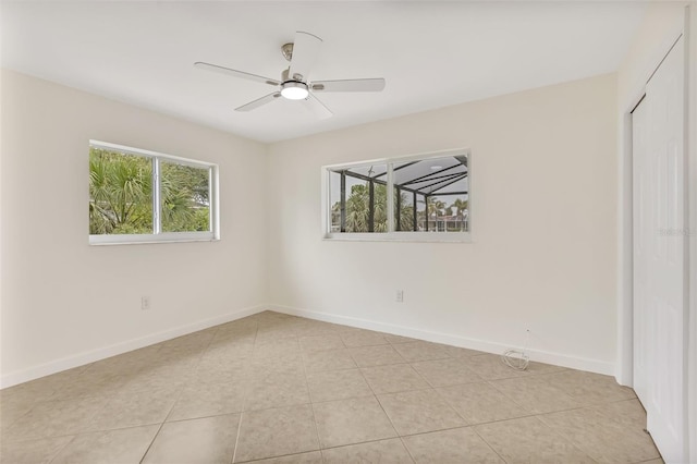 1764 Boca Raton Ct, Punta Gorda, FL 33950 - unfurnished bedroom with multiple windows, a closet, baseboards, and a ceiling fan