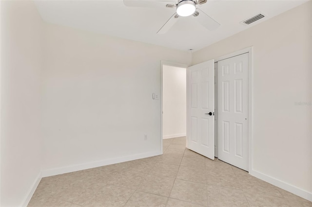1764 Boca Raton Ct, Punta Gorda, FL 33950 - unfurnished bedroom with light tile patterned floors, a closet, and baseboards