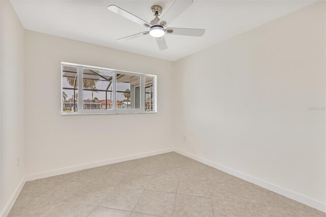 1764 Boca Raton Ct, Punta Gorda, FL 33950 - empty room featuring baseboards, light tile patterned floors, and a ceiling fan
