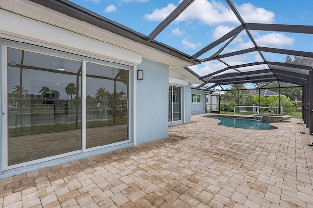 1764 Boca Raton Ct, Punta Gorda, FL 33950 - view of swimming pool featuring a patio, a pool with connected hot tub, and glass enclosure