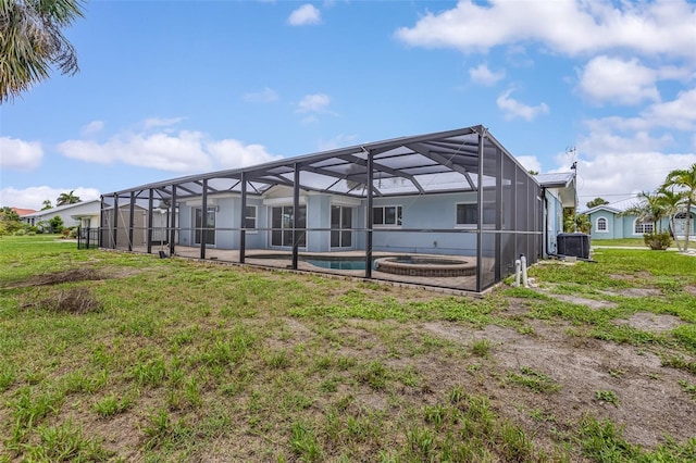 1764 Boca Raton Ct, Punta Gorda, FL 33950 - back of property with a lawn, a lanai, and a patio area