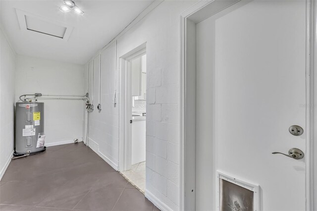 1764 Boca Raton Ct, Punta Gorda, FL 33950 - corridor featuring water heater, attic access, and tile patterned flooring