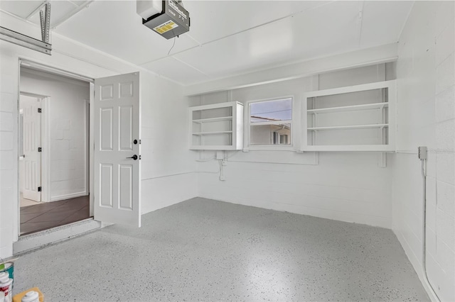 1764 Boca Raton Ct, Punta Gorda, FL 33950 - garage with a garage door opener and concrete block wall