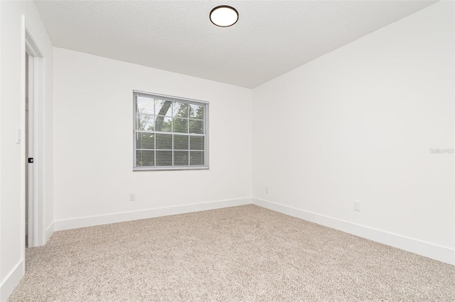 407 Ventura Dr, Sanford, FL 32773 - carpeted spare room with baseboards and a textured ceiling