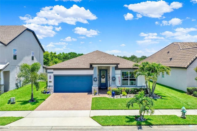 2390 Standing Rock Cir, Oakland, FL 34787 - ranch-style house featuring decorative driveway, an attached garage, a front lawn, and stucco siding