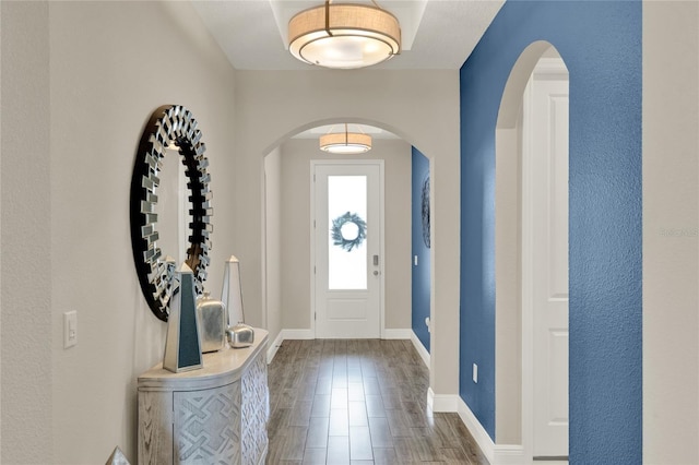 2390 Standing Rock Cir, Oakland, FL 34787 - foyer with arched walkways and wood finished floors