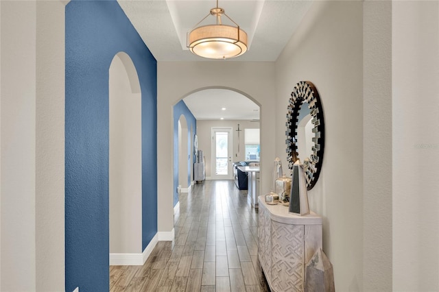 2390 Standing Rock Cir, Oakland, FL 34787 - corridor with arched walkways and wood finished floors