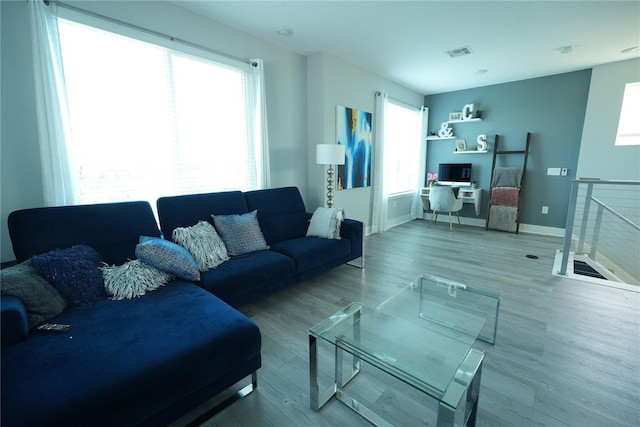 2035 White Feather Loop, Oakland, FL 34787 - living area with plenty of natural light, wood finished floors, and a desk