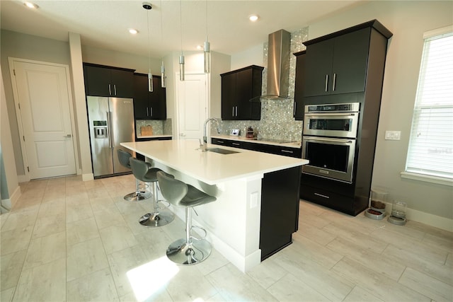 2035 White Feather Loop, Oakland, FL 34787 - kitchen with appliances with stainless steel finishes, wall chimney exhaust hood, decorative backsplash, light countertops, and recessed lighting