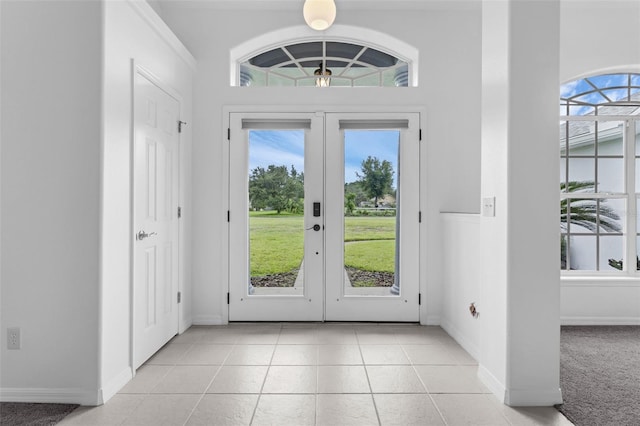 15038 Willow Ln, Tavares, FL 32778 - foyer with french doors and light tile patterned floors