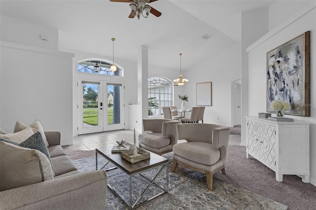 15038 Willow Ln, Tavares, FL 32778 - living area with ceiling fan, a chandelier, french doors, high vaulted ceiling, and tile patterned floors