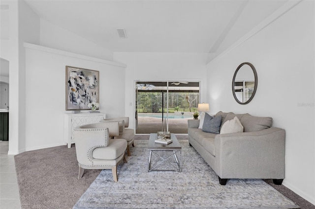 15038 Willow Ln, Tavares, FL 32778 - tiled living room featuring vaulted ceiling