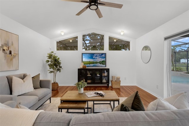 15038 Willow Ln, Tavares, FL 32778 - living room with vaulted ceiling, ceiling fan, and wood finished floors