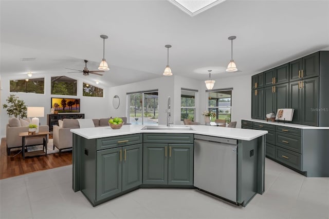 15038 Willow Ln, Tavares, FL 32778 - kitchen with stainless steel dishwasher, light countertops, ceiling fan, pendant lighting, and vaulted ceiling