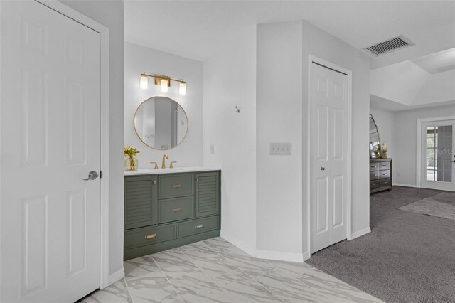15038 Willow Ln, Tavares, FL 32778 - bathroom featuring vanity and marble finish flooring