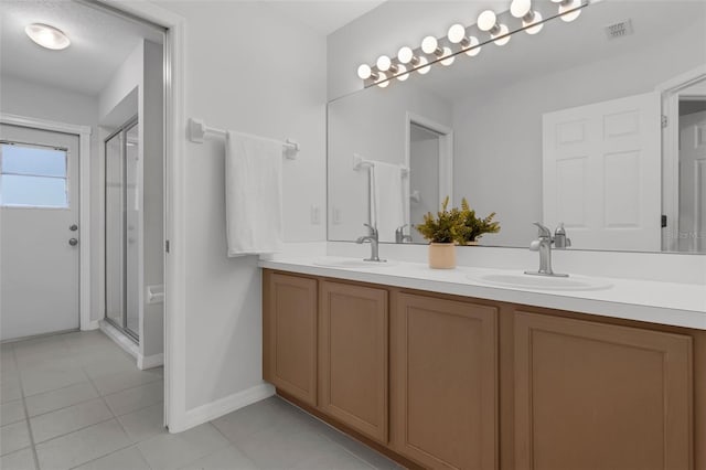 15038 Willow Ln, Tavares, FL 32778 - full bath featuring double vanity, a shower stall, and tile patterned flooring