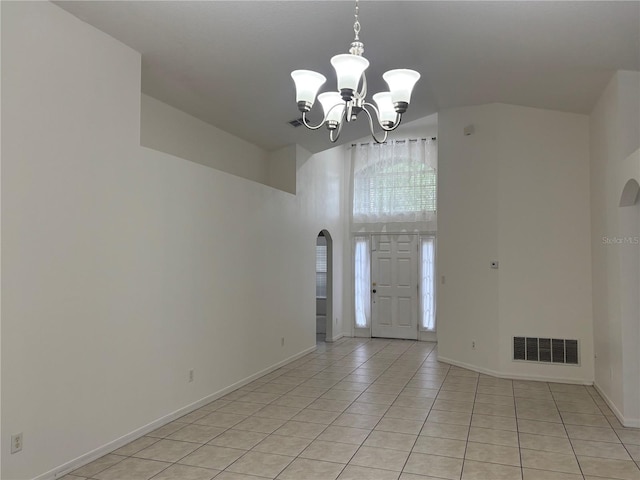 11236 Rouse Run Cir, Orlando, FL 32817 - foyer with a chandelier, light tile patterned flooring, and arched walkways