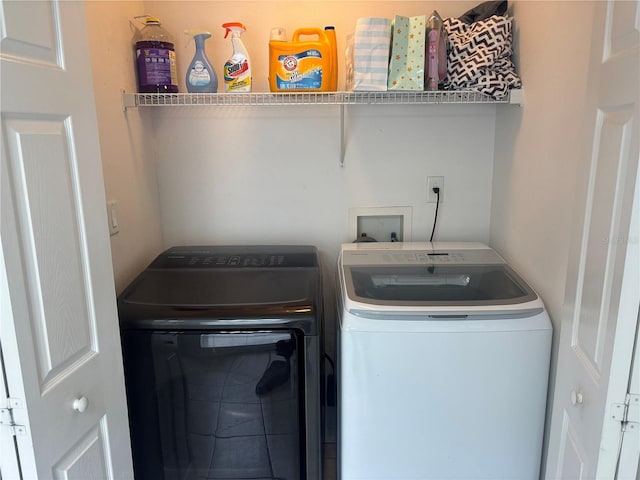 11236 Rouse Run Cir, Orlando, FL 32817 - laundry room with washer and clothes dryer