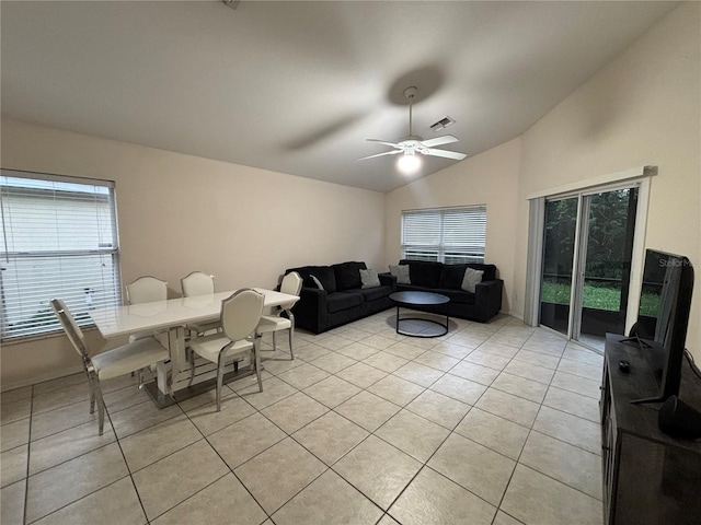 11236 Rouse Run Cir, Orlando, FL 32817 - living area featuring vaulted ceiling, light tile patterned flooring, and a ceiling fan