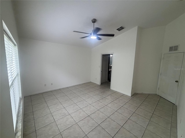 11236 Rouse Run Cir, Orlando, FL 32817 - empty room featuring lofted ceiling, a ceiling fan, and light tile patterned flooring