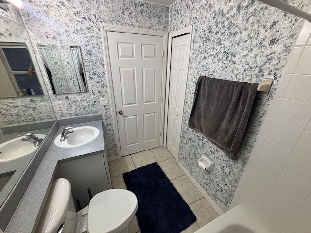11236 Rouse Run Cir, Orlando, FL 32817 - full bathroom featuring tile patterned floors, double vanity, a bathtub, and wallpapered walls