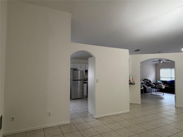 11236 Rouse Run Cir, Orlando, FL 32817 - unfurnished room featuring ceiling fan, light tile patterned floors, and arched walkways