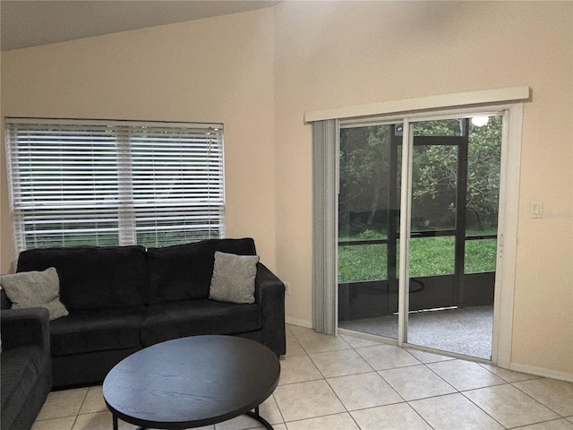 11236 Rouse Run Cir, Orlando, FL 32817 - living area featuring light tile patterned floors and baseboards