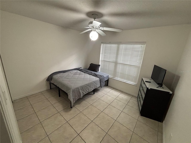 11236 Rouse Run Cir, Orlando, FL 32817 - bedroom with light tile patterned floors and ceiling fan