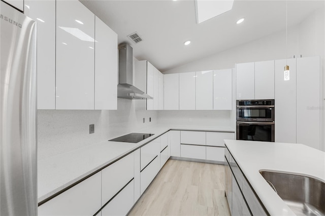 10001 Newington Dr, Orlando, FL 32836 - kitchen with wall chimney exhaust hood, stainless steel appliances, modern cabinets, vaulted ceiling, and recessed lighting