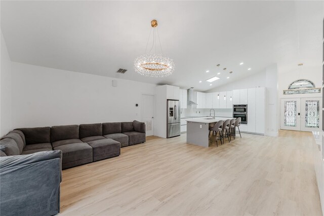 10001 Newington Dr, Orlando, FL 32836 - living room featuring a chandelier, light wood-style flooring, recessed lighting, and high vaulted ceiling