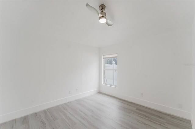 10001 Newington Dr, Orlando, FL 32836 - empty room with baseboards, light wood-style flooring, and ceiling fan
