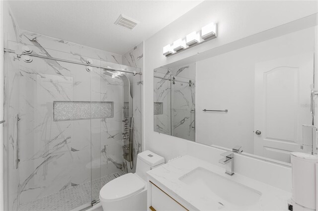 10001 Newington Dr, Orlando, FL 32836 - full bathroom with toilet, a marble finish shower, and vanity