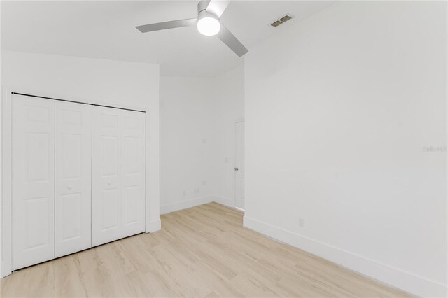 10001 Newington Dr, Orlando, FL 32836 - unfurnished bedroom with light wood-style floors, baseboards, a closet, and ceiling fan
