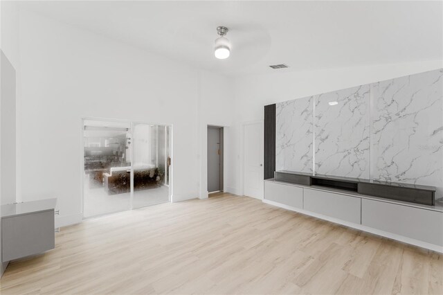 10001 Newington Dr, Orlando, FL 32836 - spare room featuring wood finished floors and high vaulted ceiling