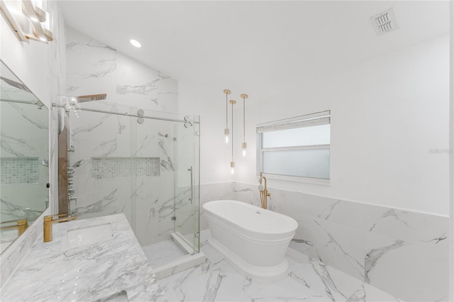 10001 Newington Dr, Orlando, FL 32836 - full bathroom featuring a marble finish shower, marble finish floors, a soaking tub, vanity, and recessed lighting