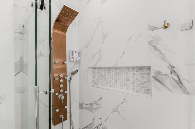 10001 Newington Dr, Orlando, FL 32836 - bathroom featuring a marble finish shower