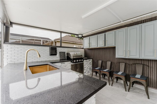 10001 Newington Dr, Orlando, FL 32836 - kitchen with a sink, dark stone countertops, and plenty of natural light