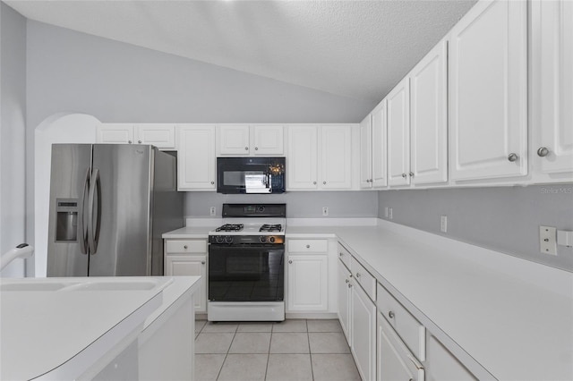 631 Lady Diana Dr, Davenport, FL 33837 - kitchen featuring black microwave, gas range, stainless steel refrigerator with ice dispenser, lofted ceiling, and light countertops