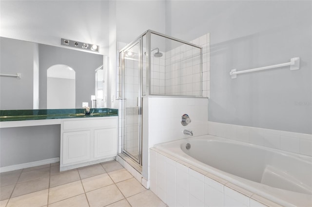 631 Lady Diana Dr, Davenport, FL 33837 - full bathroom with a garden tub, a stall shower, vanity, and tile patterned flooring