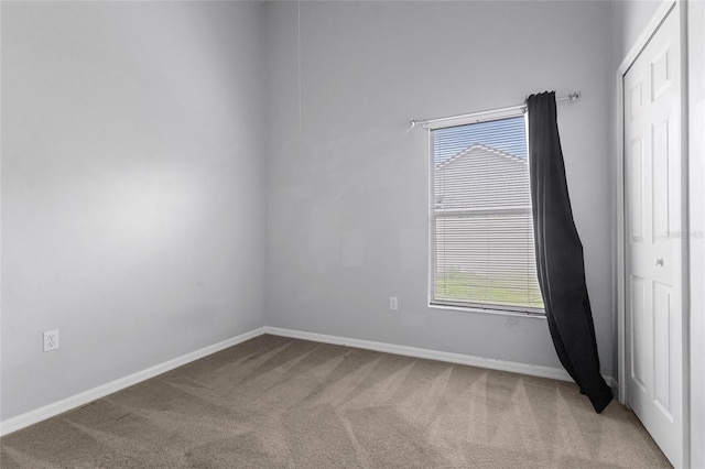 631 Lady Diana Dr, Davenport, FL 33837 - carpeted spare room featuring baseboards and plenty of natural light