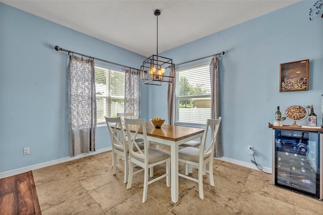 11616 Thacker Dr, Clermont, FL 34711 - dining area with a chandelier, healthy amount of natural light, and beverage cooler