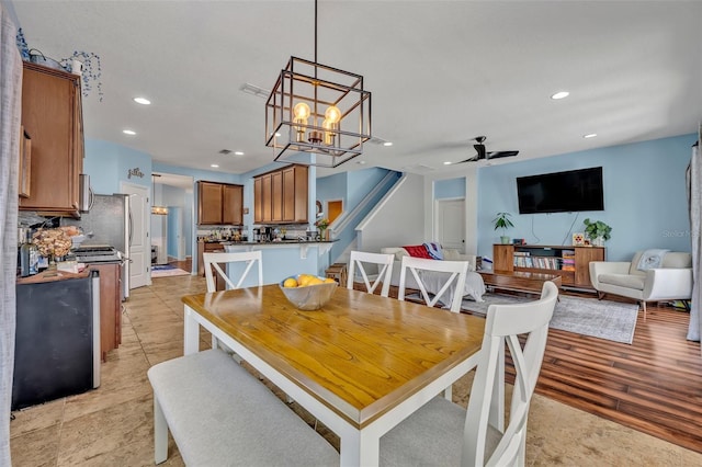 11616 Thacker Dr, Clermont, FL 34711 - dining room with recessed lighting, ceiling fan, a chandelier, and stairs