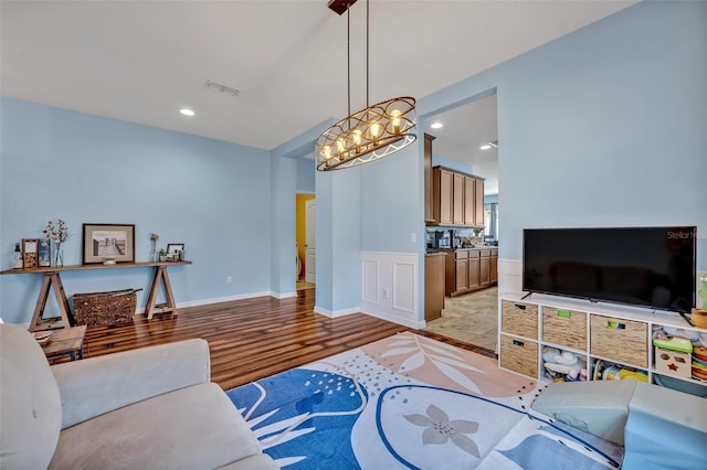 11616 Thacker Dr, Clermont, FL 34711 - living room with light wood-style flooring, recessed lighting, and a chandelier